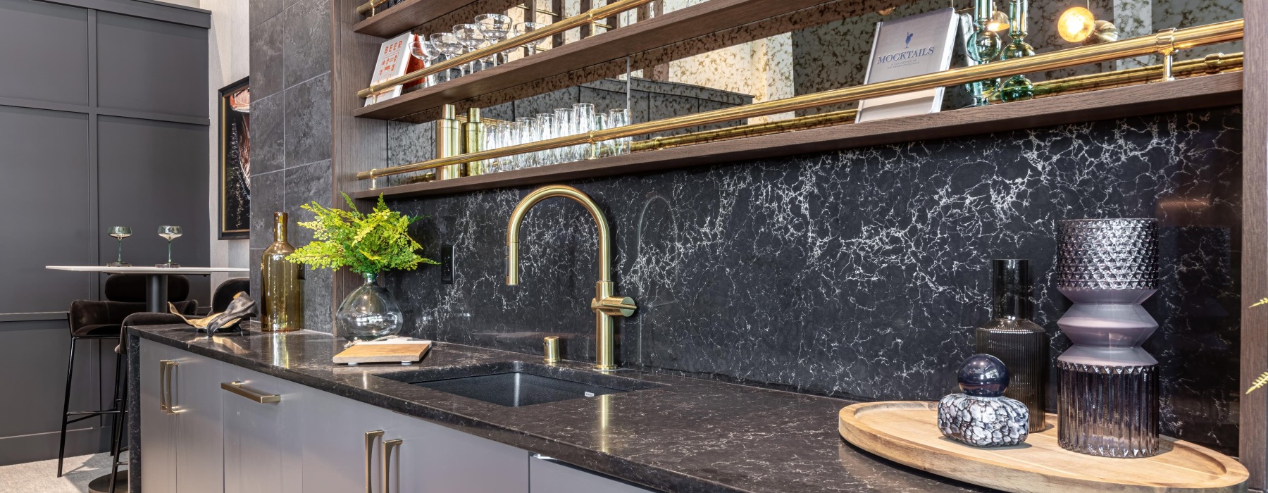 Sink and bar area of community lounge at Broadstone Riva's modern apartments in Vancouver